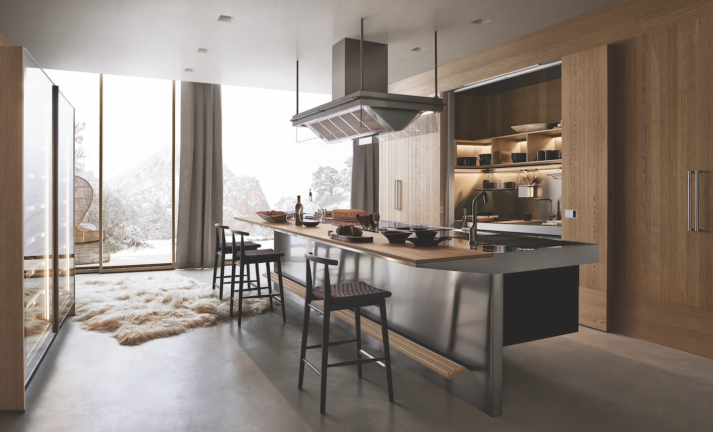 Image of an Arclinea kitchen with sliding wooden columns. The island is steel with wooden snack bars and brown stools
