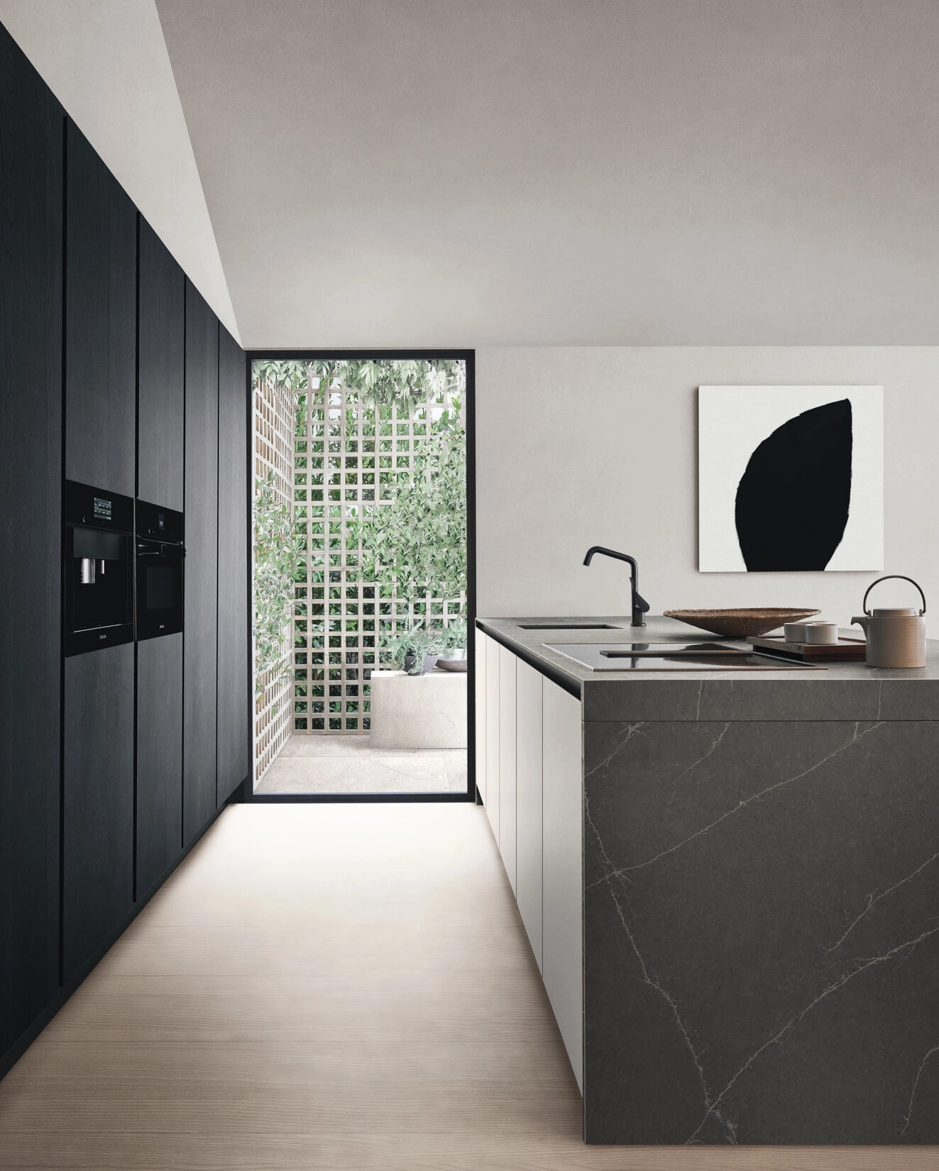 Image of an Arclinea kitchen with black columns and island with gray ceramic top and white veins